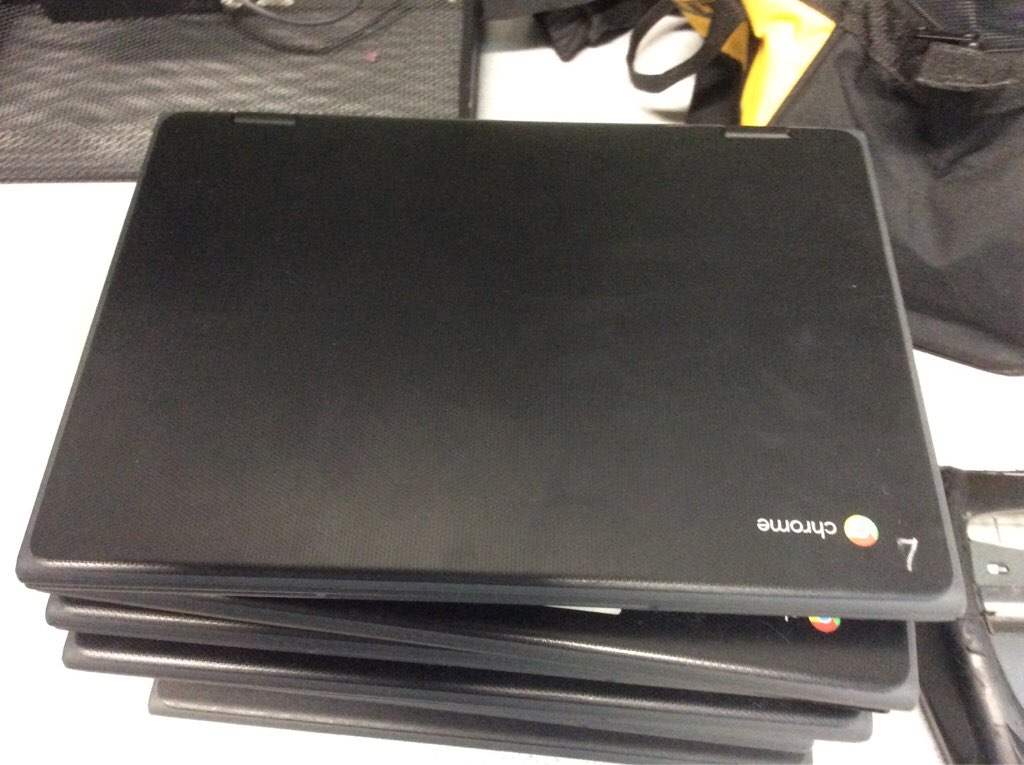 Stack of restored Chromebooks ready to return to the classroom